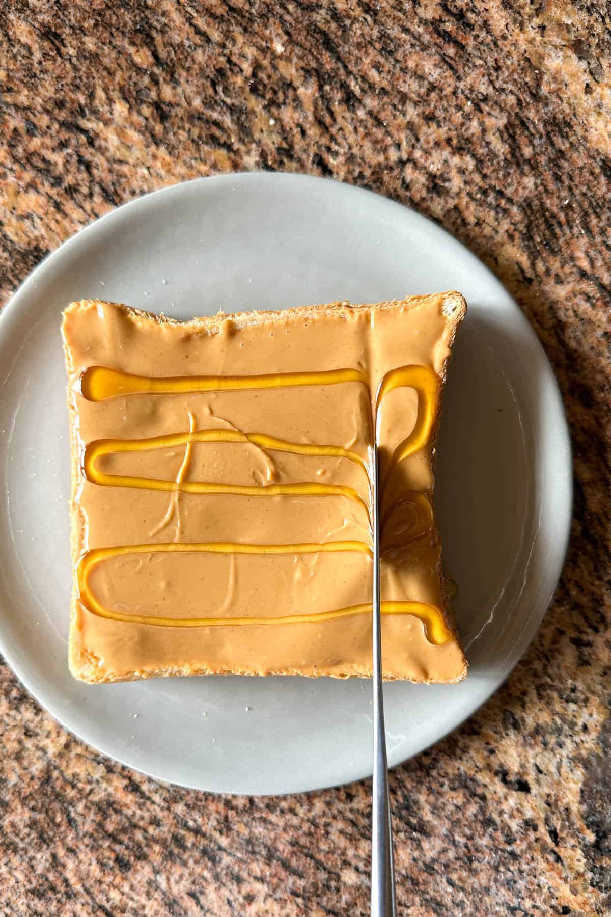 Adding honey for Peanut Butter and Honey Toast.