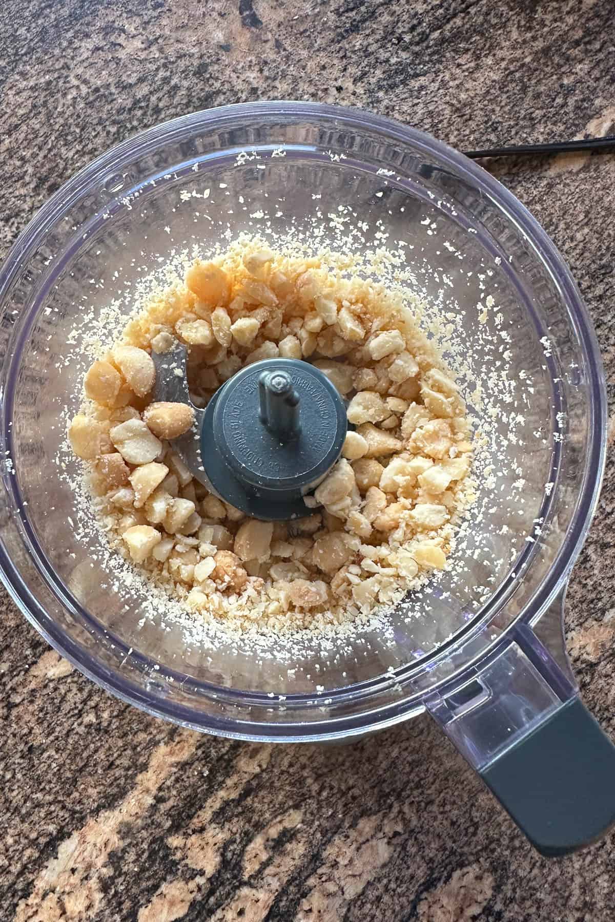 Grinding up macadamia nuts for Macadamia Nut Pesto.
