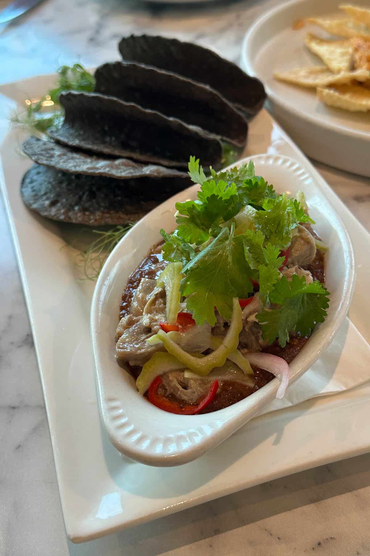 MW Restaurant garlic pork tacos with Raiz Tortillas.