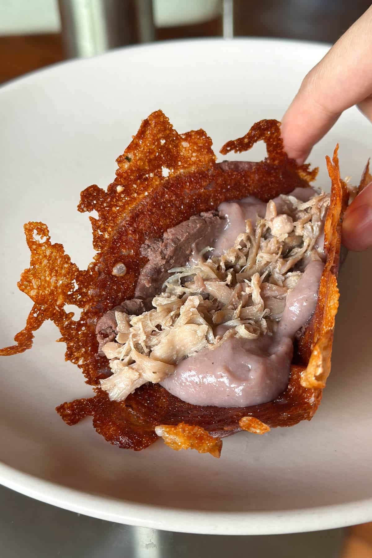 Raiz Tortilla, warm tortillas with poi and kalua pork.