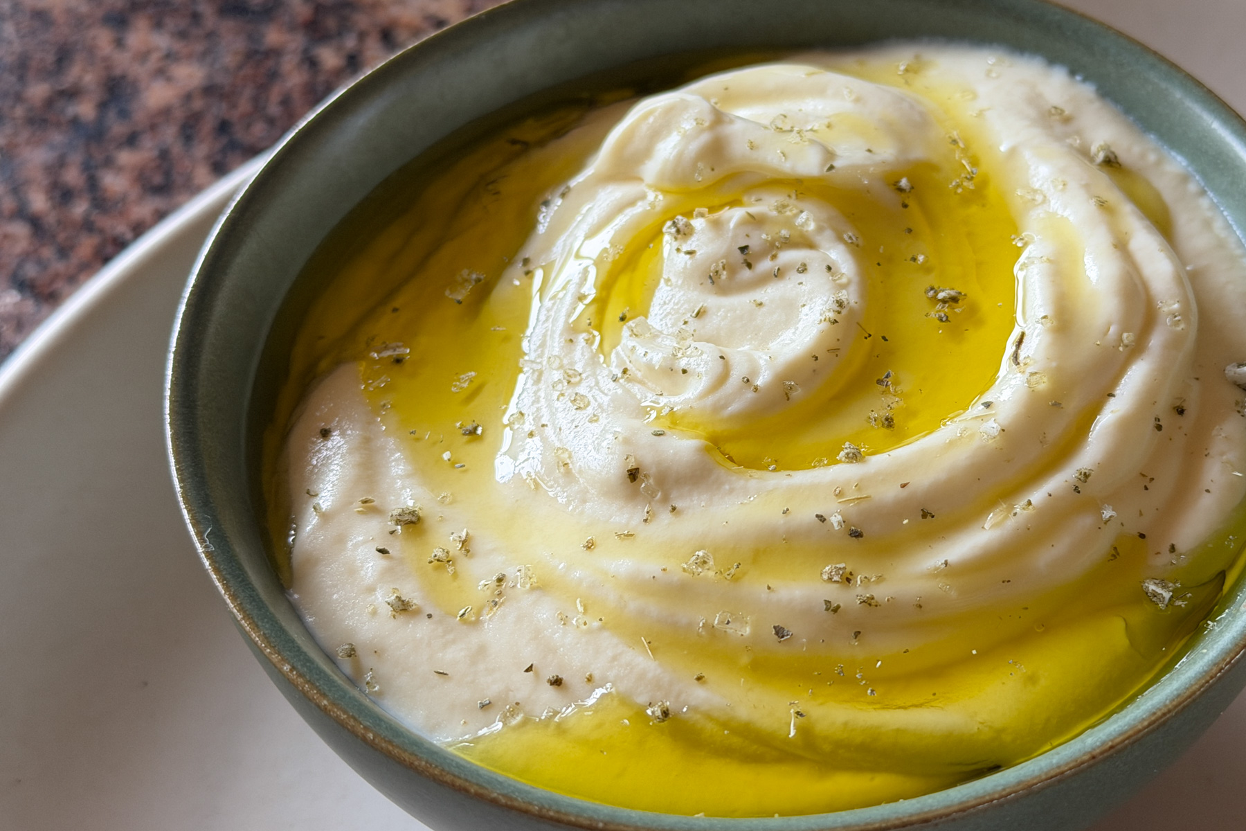 A bowl of whipped ricotta.