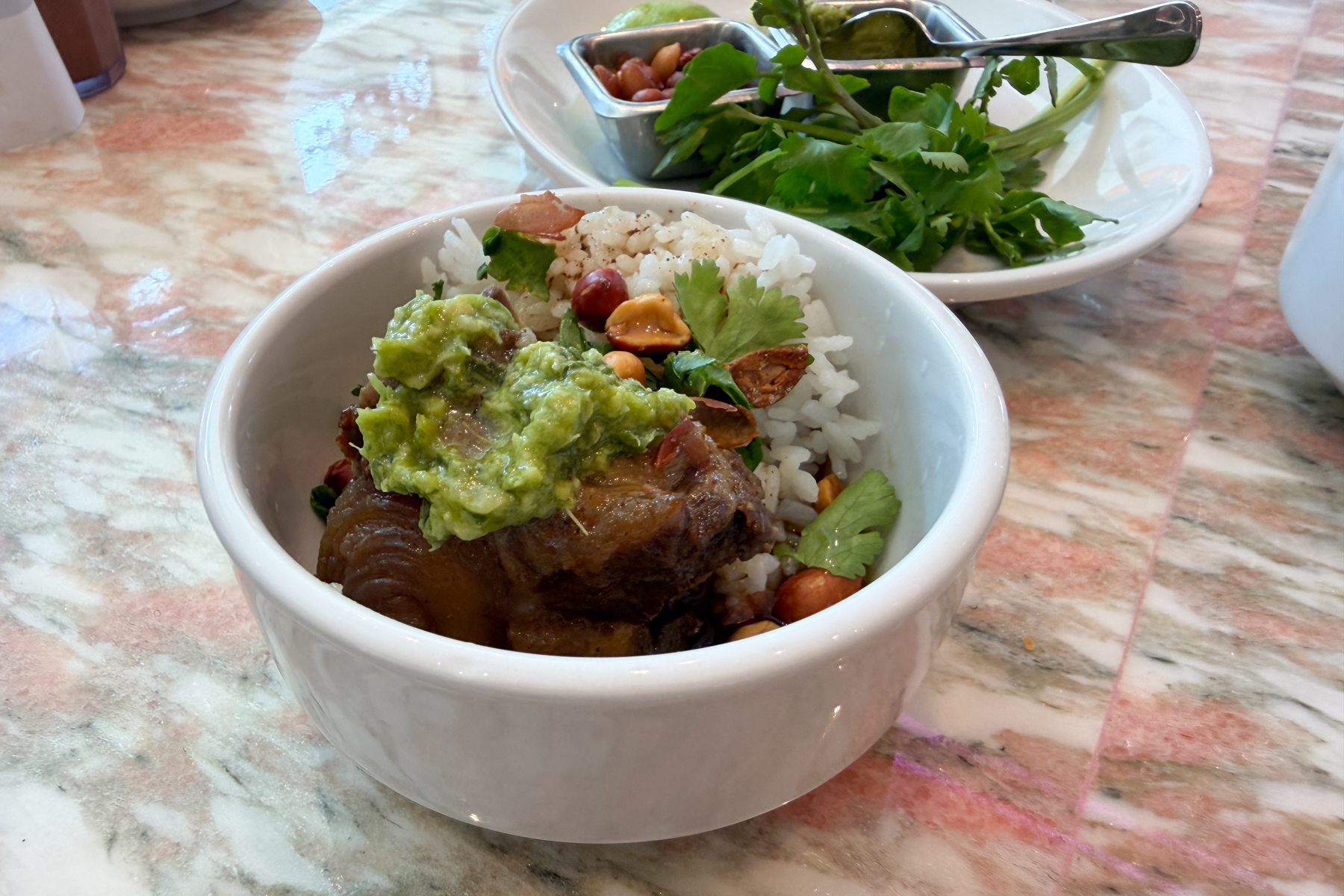 Oxtail soup spooned ou into an individual bowl at Lanai Bowl.
